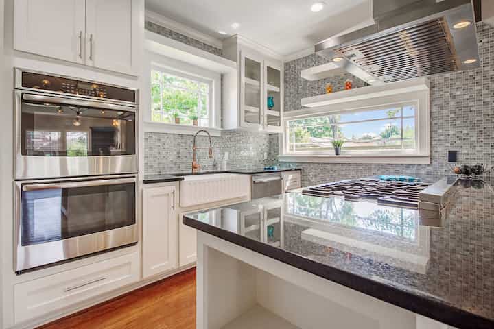 An image of a modern kitchen with sleek appliances, featuring a gas stove, refrigerator, and built-in microwave in White Plains